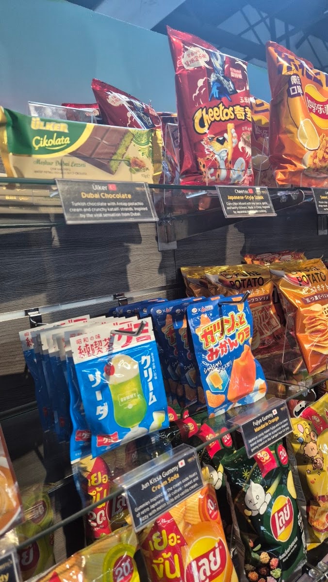 A case of exotic snacks, each with a printed description card.